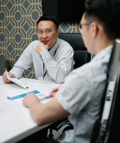 two professional advisors discussing statistics